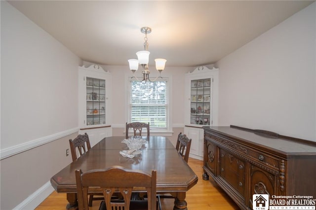 10280 Christy Rd, Sheridan, NY 14063 - dining room featuring a chandelier and light wood finished floors