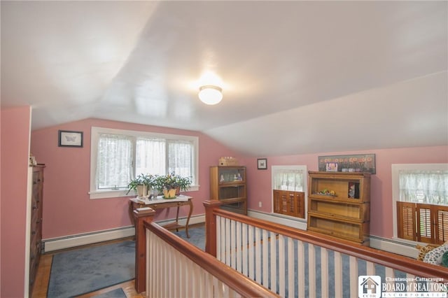 10280 Christy Rd, Sheridan, NY 14063 - corridor featuring a baseboard radiator, vaulted ceiling, baseboards, and an upstairs landing
