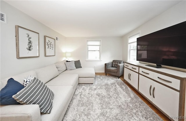4334 Connection Dr, Clarence, NY 14221 - living area featuring wood finished floors and baseboards