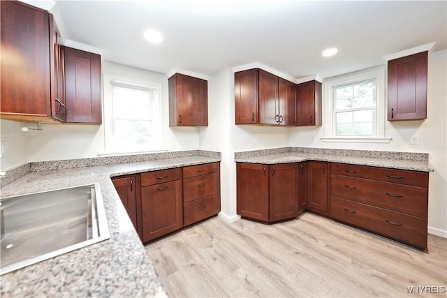 4334 Connection Dr, Clarence, NY 14221 - kitchen featuring light wood finished floors, a sink, recessed lighting, and baseboards