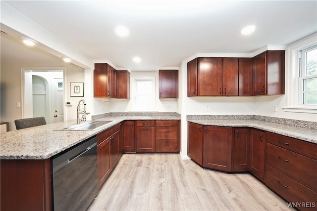 4334 Connection Dr, Clarence, NY 14221 - kitchen featuring dishwashing machine, a sink, light wood-type flooring, a peninsula, and light stone countertops