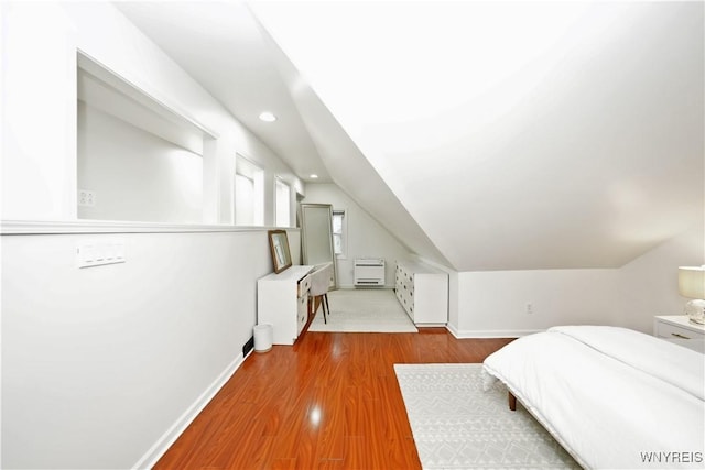 4334 Connection Dr, Clarence, NY 14221 - bedroom with recessed lighting, baseboards, lofted ceiling, and wood finished floors