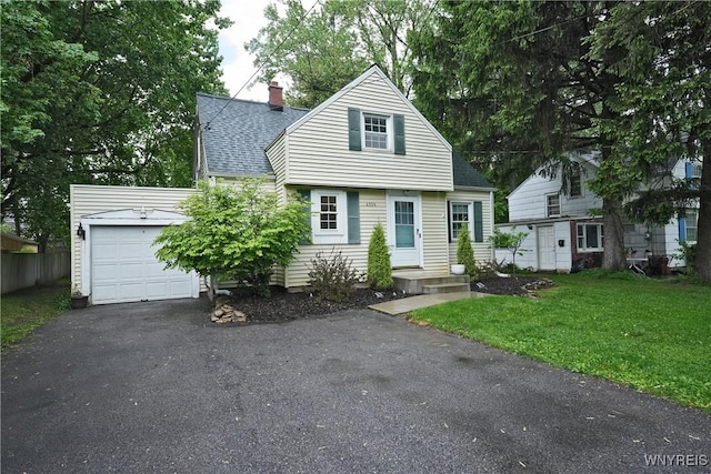 4334 Connection Dr, Clarence, NY 14221 - cape cod house with a shingled roof, driveway, a chimney, a front lawn, and an attached garage