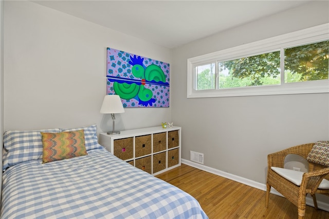 482 Marsh Rd, Pittsford, NY 14534 - bedroom featuring baseboards and wood finished floors