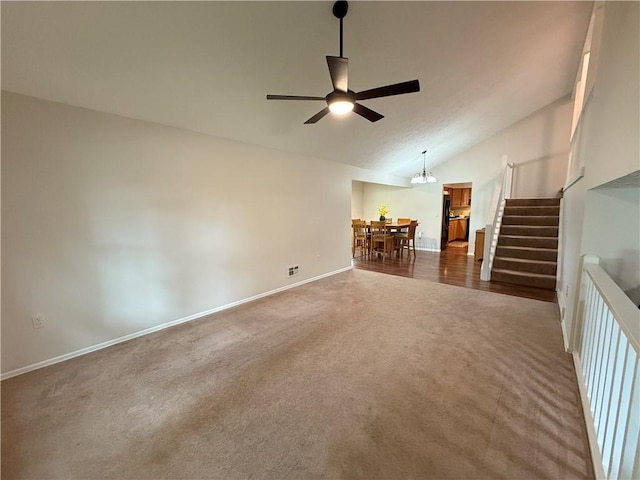 300 Amy Ln, Clarkson, NY 14420 - unfurnished living room featuring dark colored carpet, a ceiling fan, stairway, lofted ceiling, and baseboards