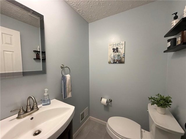 300 Amy Ln, Clarkson, NY 14420 - half bathroom with a sink, a textured ceiling, toilet, and baseboards