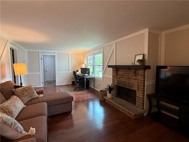 300 Amy Ln, Clarkson, NY 14420 - living area with dark wood-type flooring, a brick fireplace, and an office area