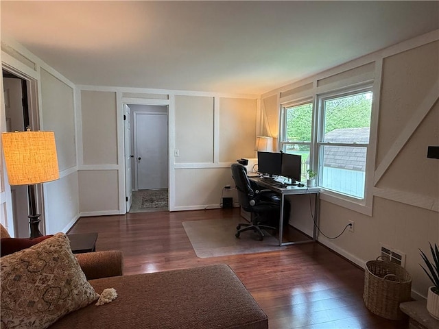 300 Amy Ln, Clarkson, NY 14420 - home office with wood finished floors, a decorative wall, and baseboards
