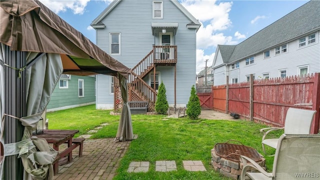 35 Duerstein St, Buffalo, NY 14210 - back of property with a fire pit, a patio area, and stairway