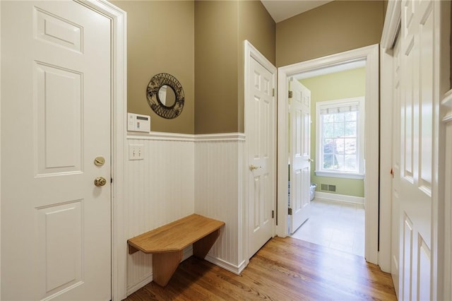 72 Meadow Cove Rd, Pittsford, NY 14534 - mudroom featuring light wood-type flooring and a wainscoted wall