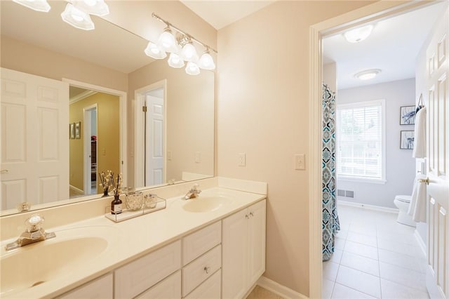 72 Meadow Cove Rd, Pittsford, NY 14534 - bathroom with double vanity, tile patterned floors, toilet, and baseboards