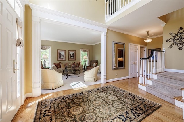 72 Meadow Cove Rd, Pittsford, NY 14534 - foyer with ornamental molding, wood finished floors, stairway, and baseboards