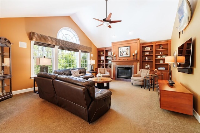72 Meadow Cove Rd, Pittsford, NY 14534 - carpeted living area featuring high vaulted ceiling, ceiling fan, a glass covered fireplace, and baseboards