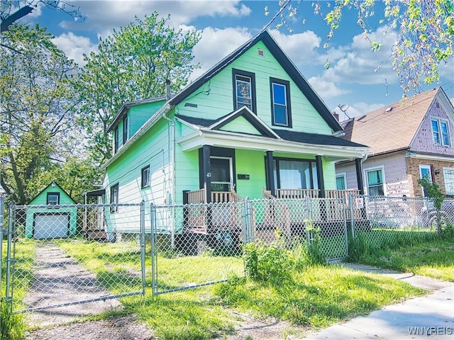 40 Federal Ave, Buffalo, NY 14215 - view of front of property with a porch, a fenced front yard, and an outdoor structure