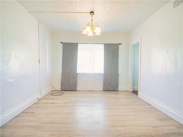 40 Federal Ave, Buffalo, NY 14215 - empty room with a chandelier, light wood-style flooring, and baseboards