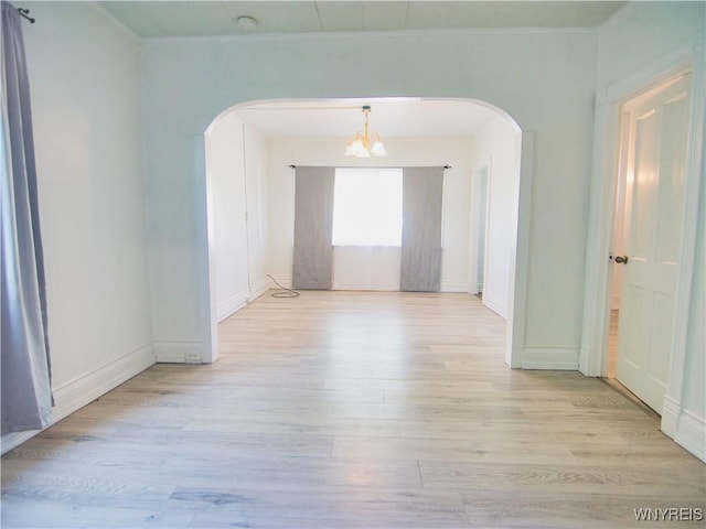 40 Federal Ave, Buffalo, NY 14215 - spare room with arched walkways, a chandelier, light wood finished floors, crown molding, and a smoke detector