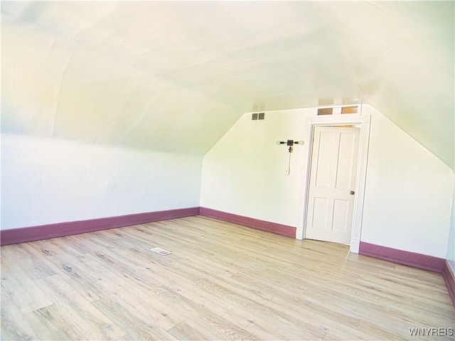 40 Federal Ave, Buffalo, NY 14215 - additional living space with vaulted ceiling, light wood finished floors, and baseboards
