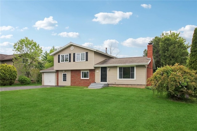 1099 N Greece Rd, Greece, NY 14626 - split level home featuring asphalt driveway, a chimney, a front yard, brick siding, and an attached garage