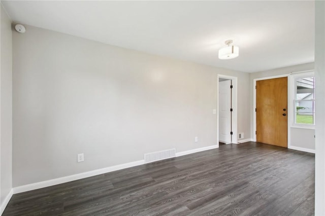 1099 N Greece Rd, Greece, NY 14626 - spare room featuring dark wood-style floors and baseboards