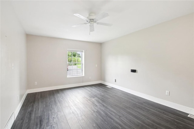 1099 N Greece Rd, Greece, NY 14626 - unfurnished room with dark wood-type flooring, ceiling fan, and baseboards