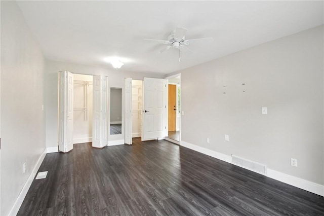 1099 N Greece Rd, Greece, NY 14626 - spare room with baseboards, dark wood-style floors, and a ceiling fan