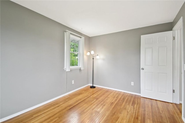 1099 N Greece Rd, Greece, NY 14626 - empty room with light wood finished floors and baseboards