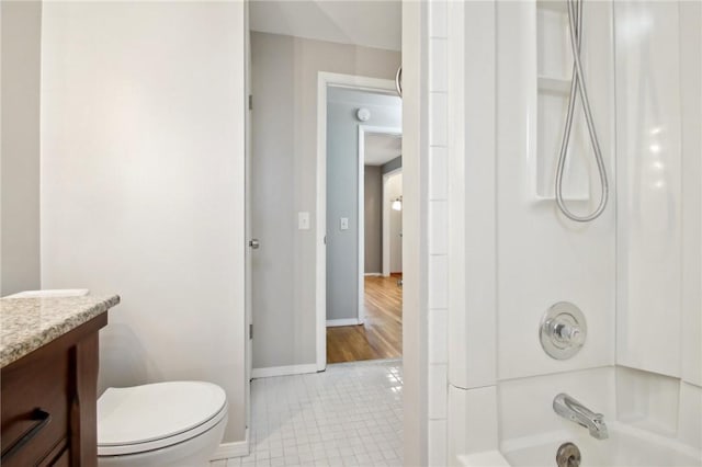 1099 N Greece Rd, Greece, NY 14626 - full bath featuring vanity, baseboards, shower / bath combination, toilet, and tile patterned floors