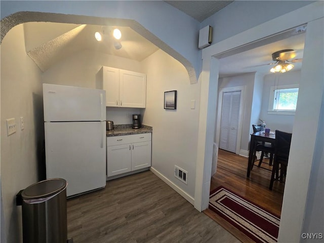 116 Mariposa St, Syracuse, NY 13206 - kitchen with freestanding refrigerator, dark wood-style flooring, a ceiling fan, and white cabinetry