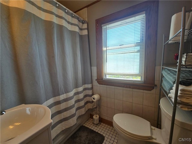 116 Mariposa St, Syracuse, NY 13206 - full bathroom with toilet, tile walls, tile patterned flooring, curtained shower, and a sink