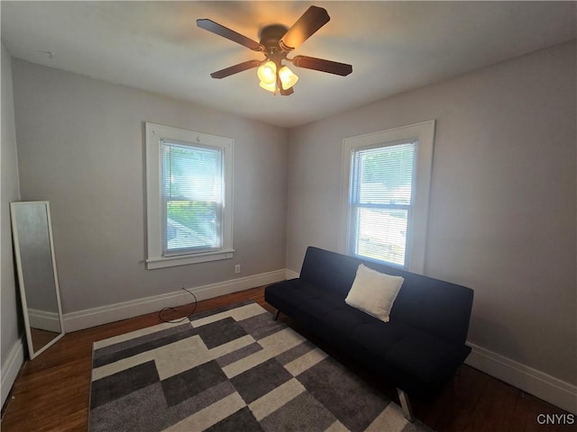 116 Mariposa St, Syracuse, NY 13206 - living area featuring healthy amount of natural light, baseboards, wood finished floors, and ceiling fan