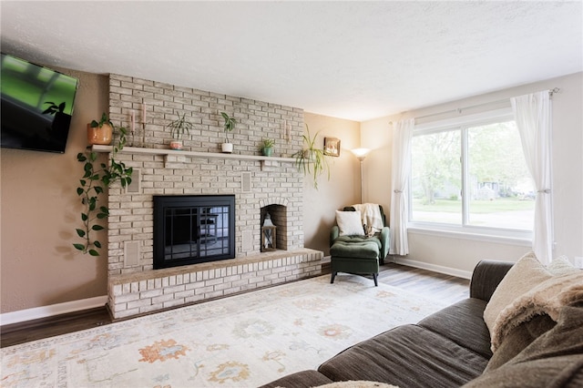 25 Selkirk Dr, Greece, NY 14626 - living area with baseboards, wood finished floors, and a fireplace