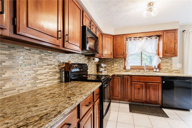 25 Selkirk Dr, Greece, NY 14626 - kitchen with black appliances, a sink, light stone counters, brown cabinetry, and a textured ceiling