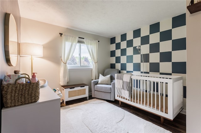 25 Selkirk Dr, Greece, NY 14626 - bedroom with an accent wall, a textured ceiling, wood finished floors, and wallpapered walls