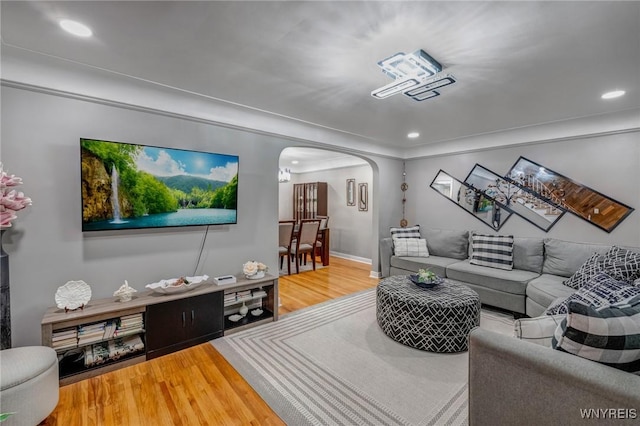 1597 Kensington Ave, Cheektowaga, NY 14215 - living area featuring arched walkways, wood finished floors, recessed lighting, and baseboards
