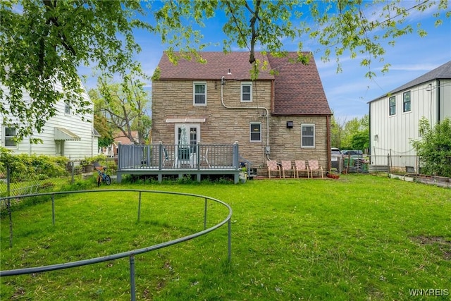 1597 Kensington Ave, Cheektowaga, NY 14215 - back of house with stone siding, a deck, and roof with shingles