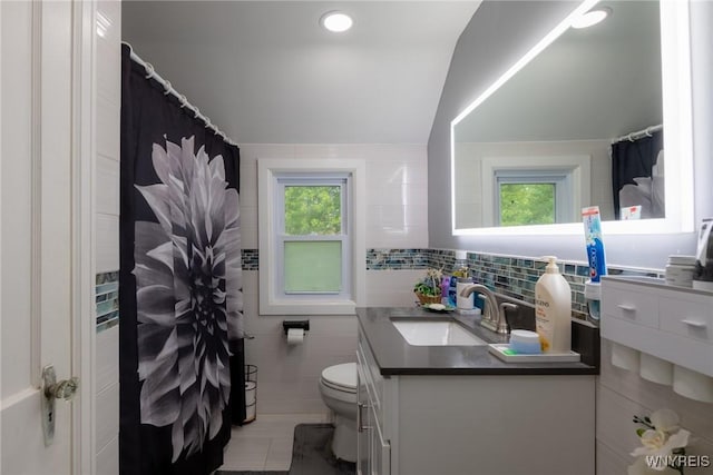 1597 Kensington Ave, Cheektowaga, NY 14215 - bathroom featuring toilet, vanity, tile walls, and a shower with shower curtain