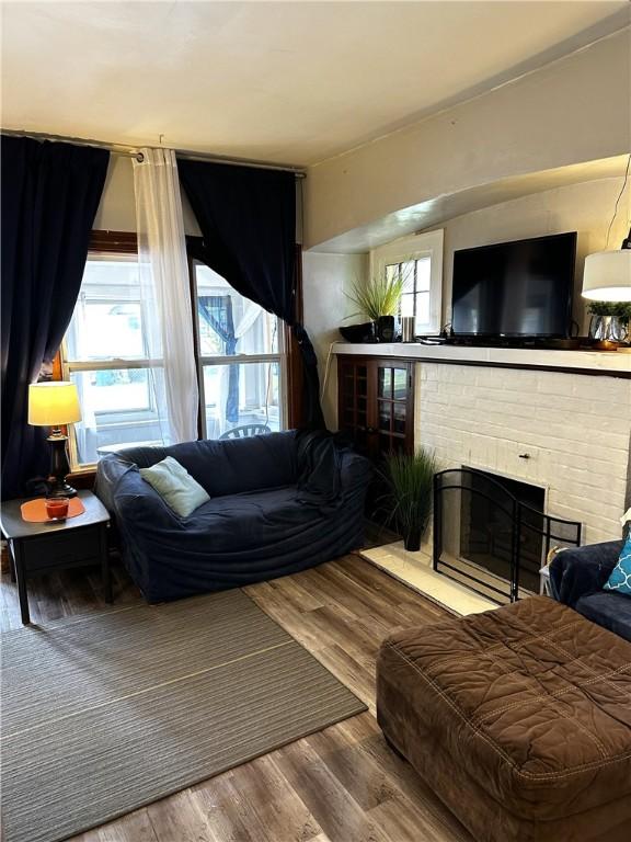386 Westfield St, Rochester, NY 14619 - living area with wood finished floors and a fireplace