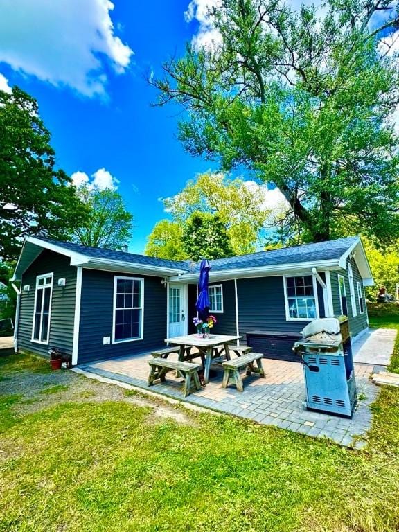 450 Stover Rd, Tyrone, NY 14815 - rear view of house with a lawn and a patio area