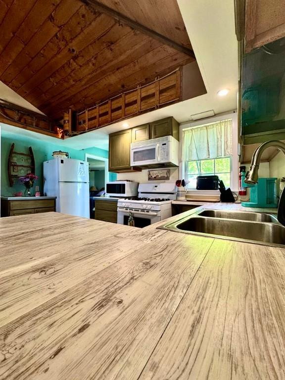 450 Stover Rd, Tyrone, NY 14815 - kitchen with white appliances, a sink, vaulted ceiling, wooden ceiling, and light countertops