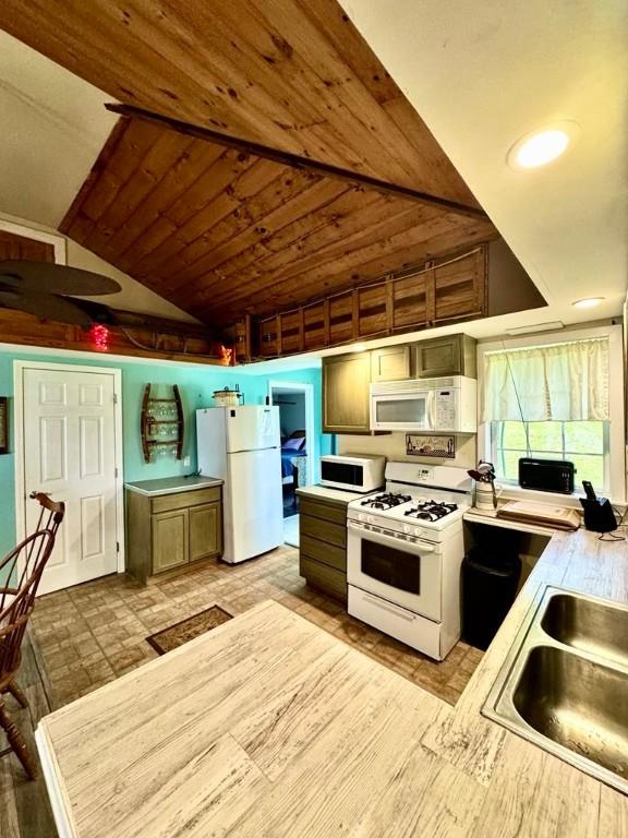 450 Stover Rd, Tyrone, NY 14815 - kitchen featuring white appliances, a sink, light countertops, lofted ceiling, and wooden ceiling