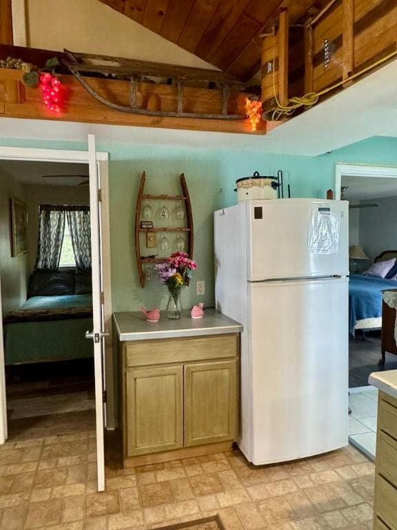 450 Stover Rd, Tyrone, NY 14815 - kitchen with freestanding refrigerator, lofted ceiling, light countertops, and wood ceiling