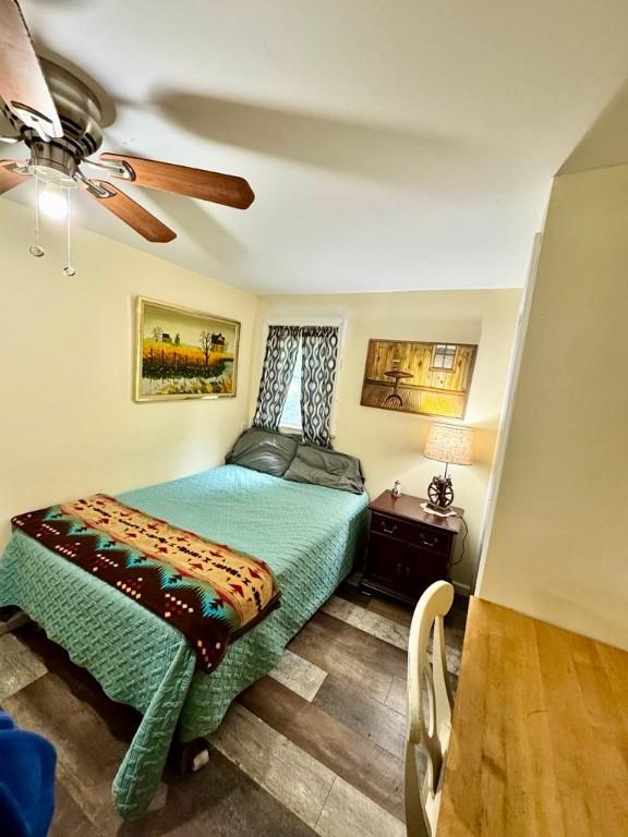 450 Stover Rd, Tyrone, NY 14815 - bedroom featuring ceiling fan and wood finished floors