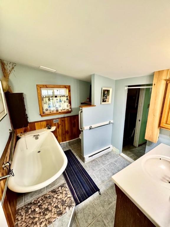 450 Stover Rd, Tyrone, NY 14815 - full bathroom featuring a bath, vanity, and baseboard heating