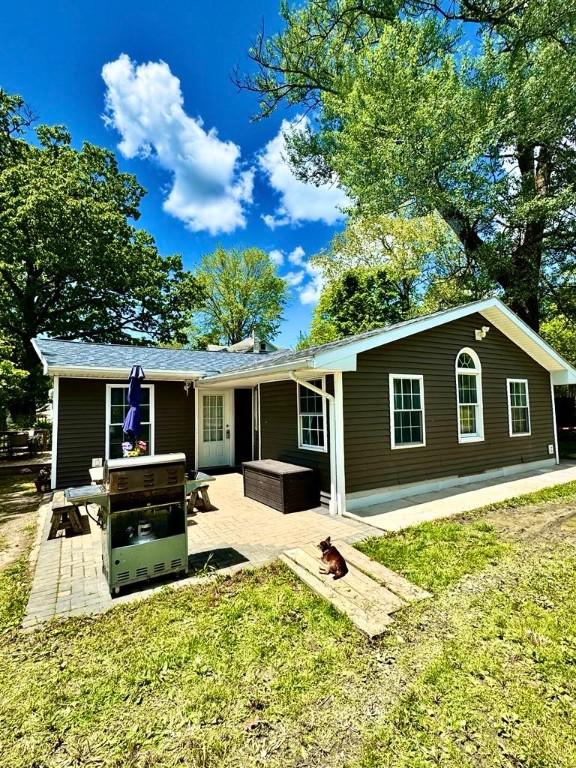 450 Stover Rd, Tyrone, NY 14815 - rear view of house featuring a patio and a lawn