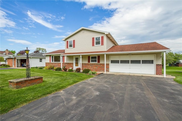63 Shadywood Dr, Gates, NY 14606 - traditional home with brick siding, a garage, driveway, and a front yard