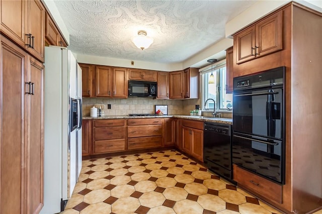 63 Shadywood Dr, Gates, NY 14606 - kitchen featuring black appliances, brown cabinetry, light floors, and a sink