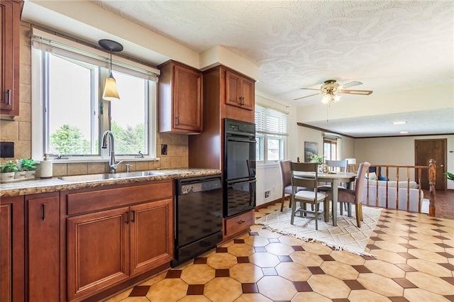 63 Shadywood Dr, Gates, NY 14606 - kitchen featuring black appliances, a sink, a textured ceiling, pendant lighting, and tasteful backsplash