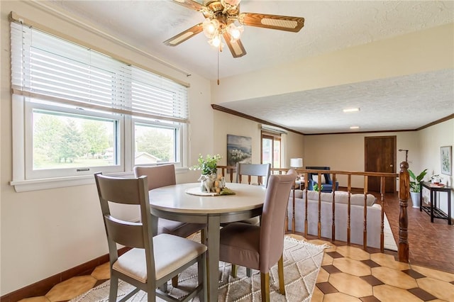 63 Shadywood Dr, Gates, NY 14606 - dining room featuring a textured ceiling, ceiling fan, crown molding, and baseboards