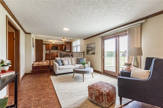 63 Shadywood Dr, Gates, NY 14606 - living room featuring ornamental molding, tile patterned flooring, baseboards, and ceiling fan