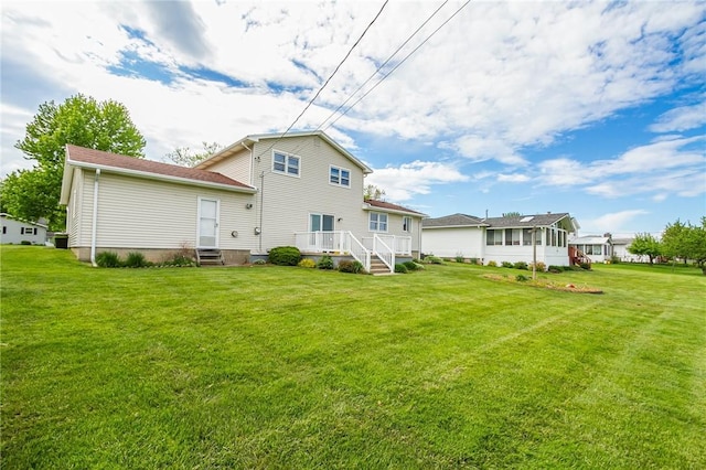 63 Shadywood Dr, Gates, NY 14606 - rear view of property featuring a lawn